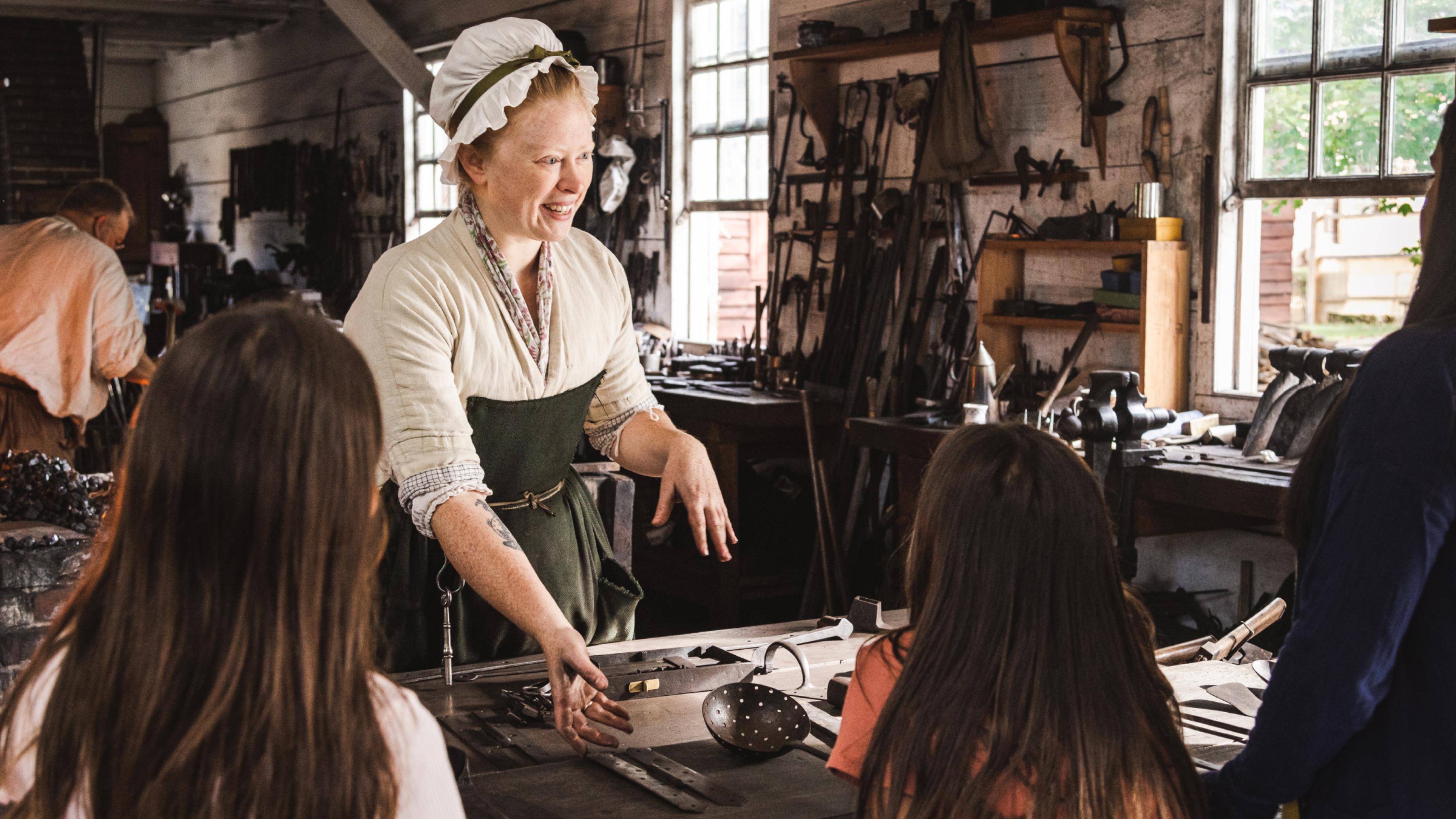 People interacting in a historical workshop